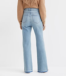 Petite Let Down Hem High Rise Relaxed Flare Jeans in Vintage Light Indigo Wash carousel Product Image 3