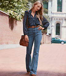 Petite Pintucked High Rise Slim Flare Jeans in Medium Stone Wash carousel Product Image 1