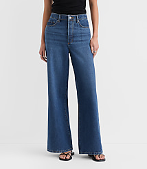 Rivete Petite Curvy High Rise Relaxed Wide Leg Jeans in Mid Wash carousel Product Image 1