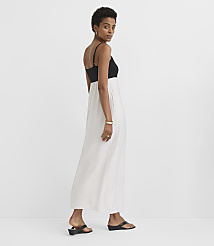 A woman in a black and white maxi dress stands against a plain white background. carousel Product Image 2