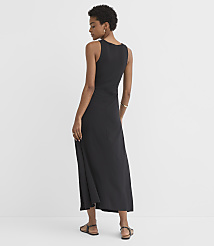A woman in a black maxi dress stands against a plain white background. carousel Product Image 2