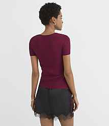 A woman in a maroon t-shirt and black lace-trimmed shorts stands against a plain white background. carousel Product Image 2