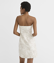 A woman in a strapless floral dress stands against a plain white background. carousel Product Image 3