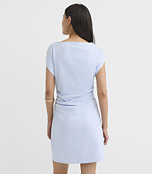 A woman in a light blue, textured dress stands against a plain white background. carousel Product Image 2