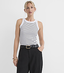 A woman in a striped tank top and black pants stands against a plain white background. carousel Product Image 2