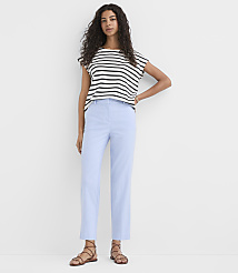 A woman in a striped shirt and light blue pants stands against a plain white background. carousel Product Image 1