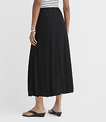A person wearing a black bubble skirt and a striped top stands against a plain white background. carousel Product Image 3