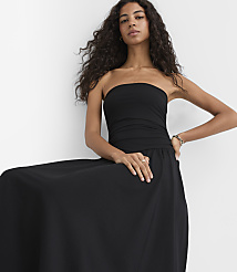 A woman in a black strapless dress poses against a plain white background. carousel Product Image 3
