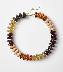 A colorful beaded necklace with amber, wood, and dark brown beads is laid out on a plain white background. carousel Product Image 1