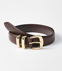 A brown leather belt with a gold buckle and three gold loops rests on a white background. carousel Product Image 1