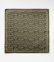 A square silk scarf with a repeating paisley pattern in shades of green, cream, and peach is laid flat against a plain white background. carousel Product Image 2