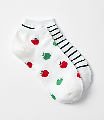 A pair of white ankle socks, one adorned with red apples and green pears, the other with black and white stripes, rests on a plain white background. carousel Product Image 1