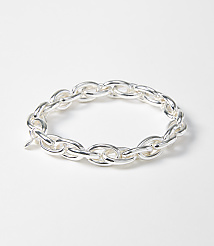 A silver chain bracelet with oval links rests on a plain white background. carousel Product Image 1