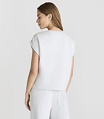 A woman in a light gray t-shirt and pants stands against a plain white background. carousel Product Image 3