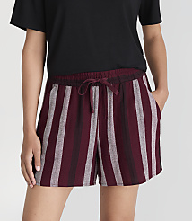 A person in a black t-shirt and striped burgundy shorts stands against a plain white background. carousel Product Image 2