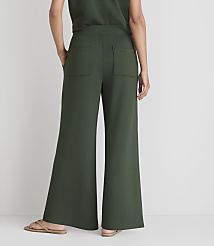 A person wearing green wide-leg pants and sandals stands against a plain white background. carousel Product Image 3