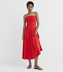 A woman in a red strapless dress stands against a plain white background. carousel Product Image 1