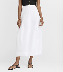 A person in a white skirt and black top stands against a plain white background. carousel Product Image 2