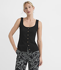 A woman in a black ribbed tank top and patterned pants stands against a plain white background. carousel Product Image 1