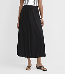 A woman in a black maxi skirt and a striped top stands against a plain white background. carousel Product Image 2