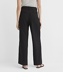 A person wearing black wide-leg pants and sandals stands against a plain white background. carousel Product Image 2