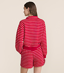A woman in a red and white striped sweatshirt and shorts stands against a plain, light-colored background. carousel Product Image 2