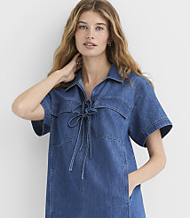A woman in a denim dress stands against a plain white background. carousel Product Image 2