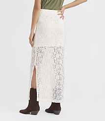 A person in a white lace skirt and brown boots stands against a plain white background. carousel Product Image 3