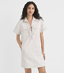 A woman in a light-colored dress stands against a plain white background. carousel Product Image 2