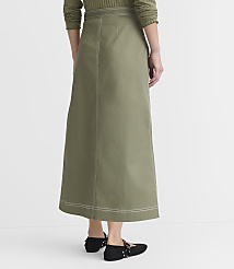 A person wearing a long, olive-green skirt with white stitching stands against a plain white background. carousel Product Image 3