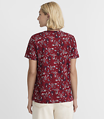 A woman in a red paisley t-shirt stands against a plain white background. carousel Product Image 3
