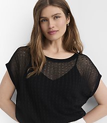 A woman with long brown hair wears a sheer black top over a camisole, with a plain white background. carousel Product Image 1