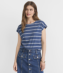 A woman in a blue and white striped t-shirt and denim skirt stands against a plain white background. carousel Product Image 1