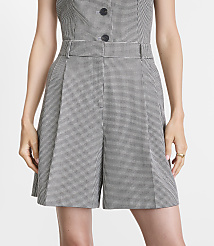 A person in a houndstooth patterned shorts and top stands against a plain white background. carousel Product Image 2