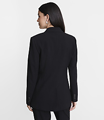 A woman in a black blazer stands against a plain white background. carousel Product Image 3