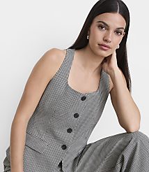 A woman in a houndstooth vest and pants poses against a plain white background. carousel Product Image 2