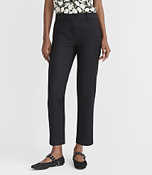 A person in black pants and a floral top stands against a plain white background. carousel Product Image 1
