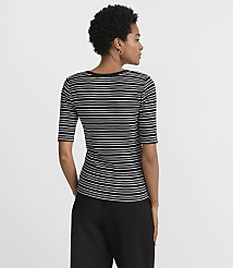 A woman in a black and white striped shirt and black pants stands against a plain white background. carousel Product Image 3