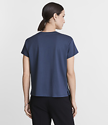 A woman in a blue t-shirt and black pants stands against a plain white background. carousel Product Image 3