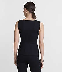 A woman in a black top and pants stands against a plain white background. carousel Product Image 3