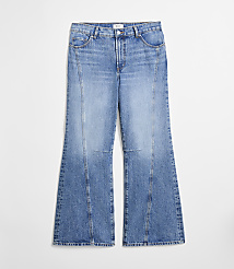 A pair of light blue flared jeans with vertical seams are displayed against a plain white background. carousel Product Image 3