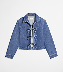 A blue denim jacket with bow closures in the foreground is set against a plain white background. carousel Product Image 5