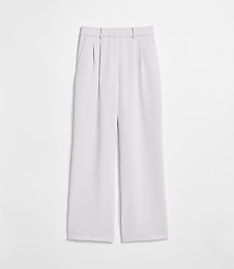 Light gray wide-leg trousers with pleats are laid flat against a plain white background. carousel Product Image 5