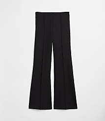 Black flared pants with vertical seams are laid flat against a plain white background. carousel Product Image 5