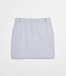 A light blue, textured mini skirt with pockets lies flat against a plain white background. carousel Product Image 5