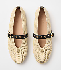 A pair of beige woven flats with black straps and gold buckles rests on a plain white background. carousel Product Image 3
