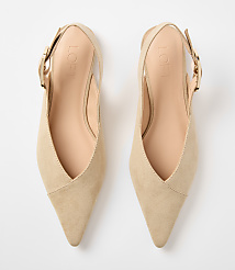 A pair of beige suede slingback heels with pointed toes and gold buckles rests on a plain white background. carousel Product Image 3