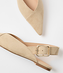 A pair of beige suede slingback heels with pointed toes and gold buckles rests on a white background. carousel Product Image 2