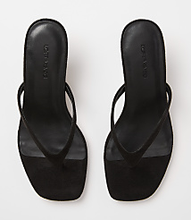 A pair of black suede thong sandals with square toes rests on a plain white background. carousel Product Image 3