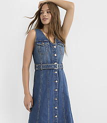 A young woman in a denim dress stands against a plain white background. carousel Product Image 2
